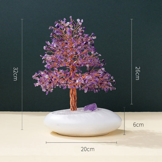 Close-up of the details of the crystal tree's branches and leaves, showcasing the unique combination of colors and energy of natural citrine, amethyst and rose quartz.