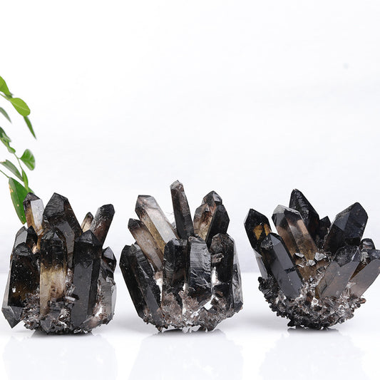 Main product shot of natural smoky quartz cluster showing smoky points and raw base