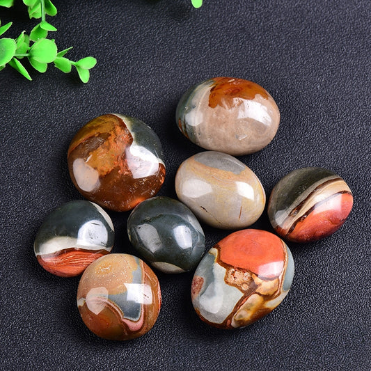 Main shot of natural Ocean Jasper palm stone showing unique ocean patterns