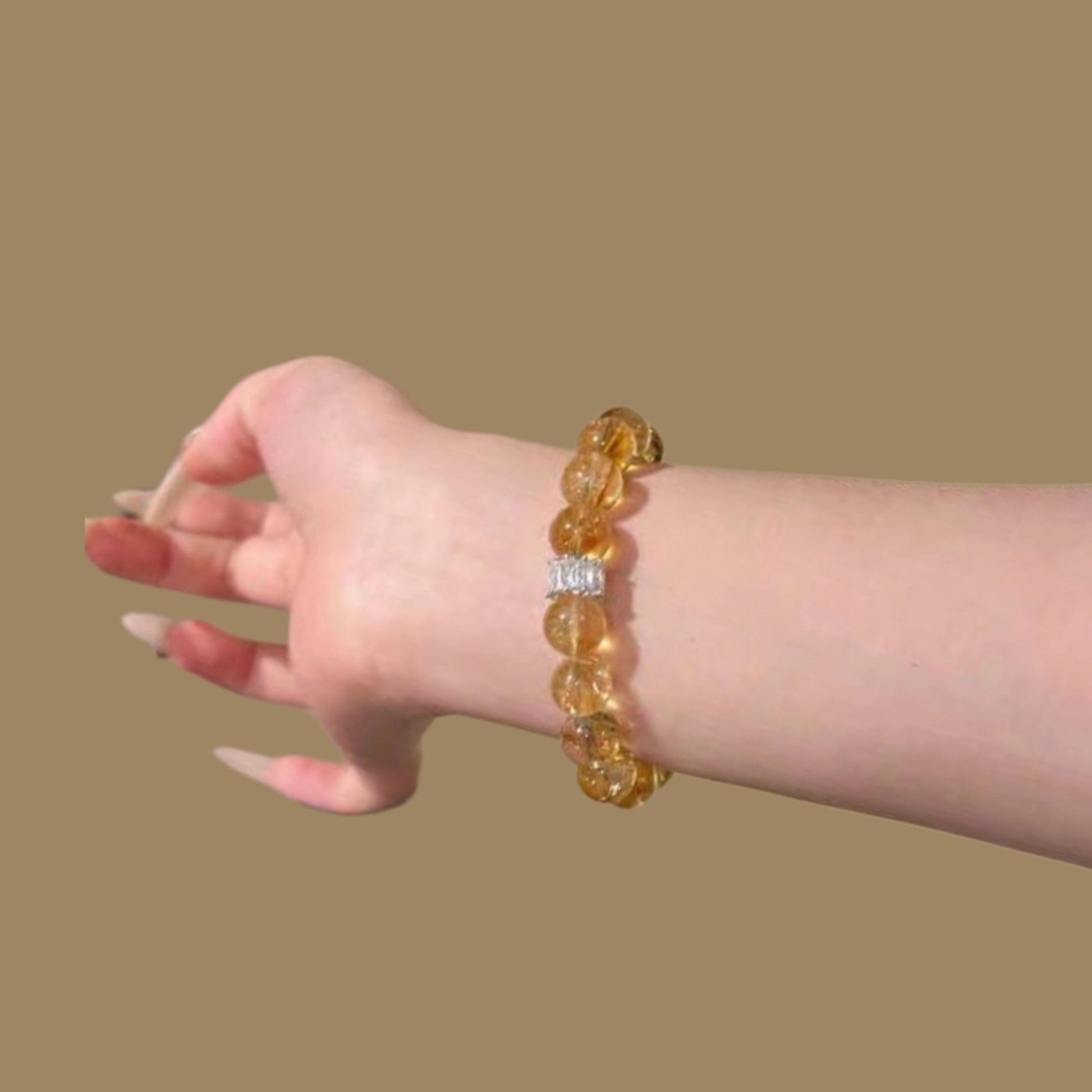 Wearing a bracelet on the wrist and pairing it with business items showcases its role in boosting confidence and attracting opportunities in business Settings