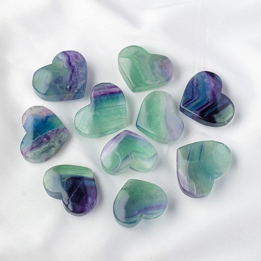 The colorful fluorite heart-shaped carvings carefully packaged in the gift box, tied with elegant ribbons, make it the perfect choice as a token of love or a blessing gift.