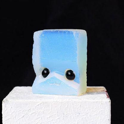 A hedgehog figurine placed together with a pair of rings symbolizes "the company of wisdom".