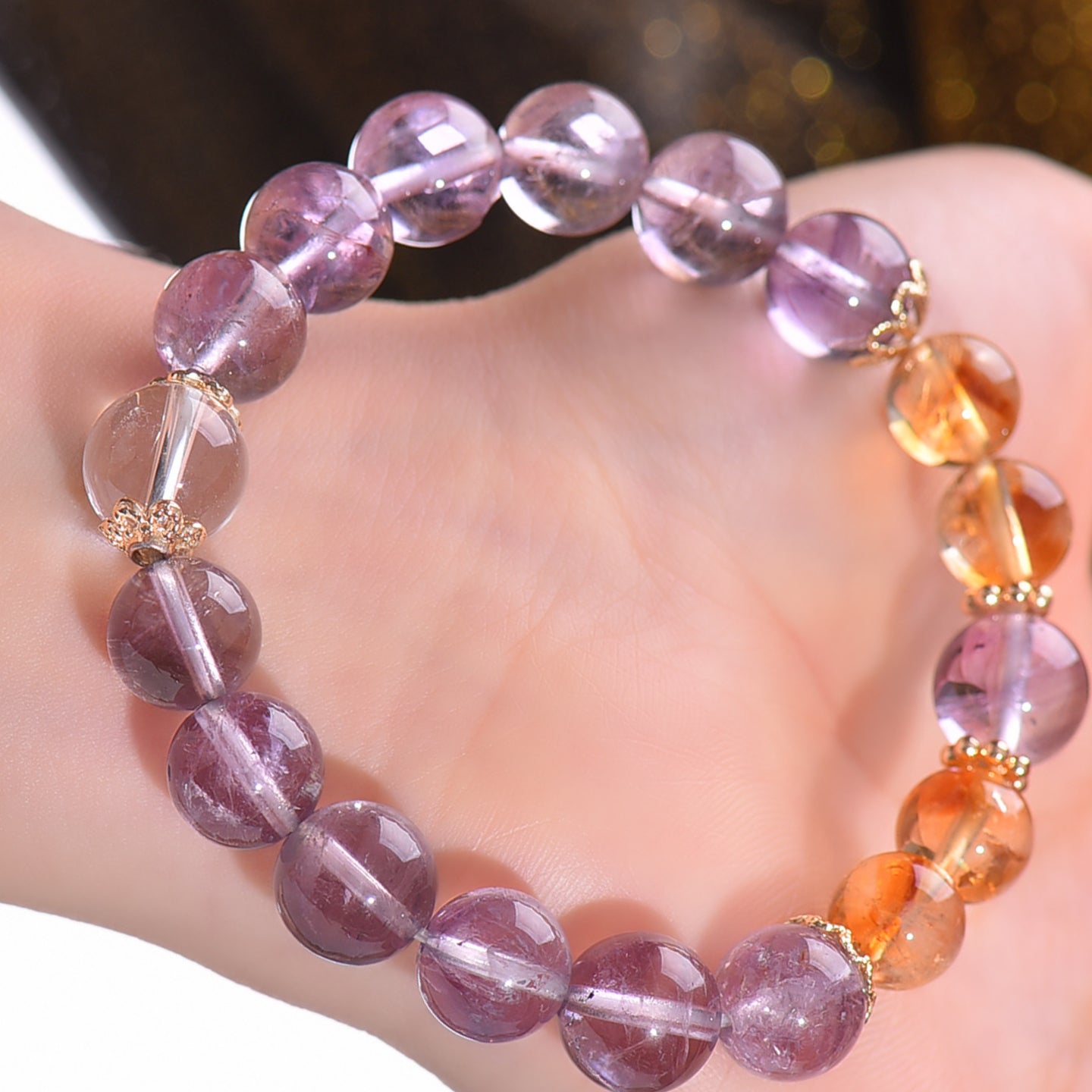 The bracelet is displayed flat, highlighting its dual energy effects of attracting wealth and changing one's fortune