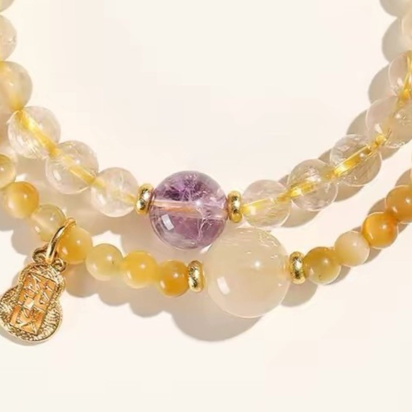 The double-loop bracelet is displayed flat, highlighting its dual core functions of attracting wealth and promoting career advancement