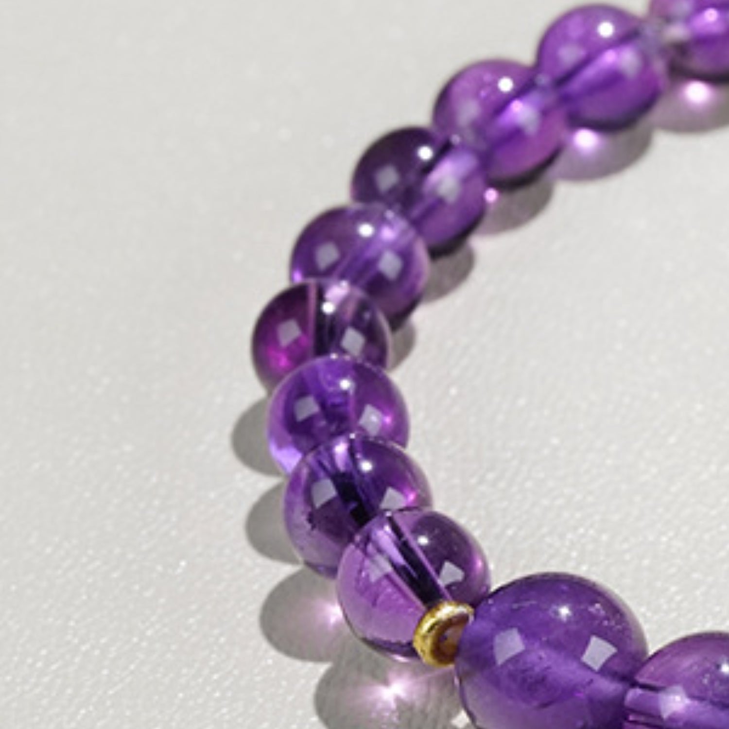 A close-up of the deep color of amethyst highlights its characteristic of enhancing wisdom and spiritual energy