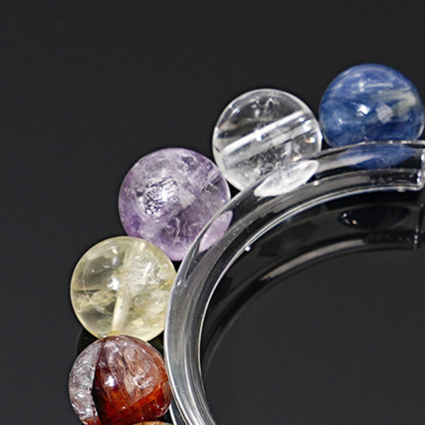 A close-up of aquamarine's clear crystal highlights its energy characteristics that enhance communication skills and language expression