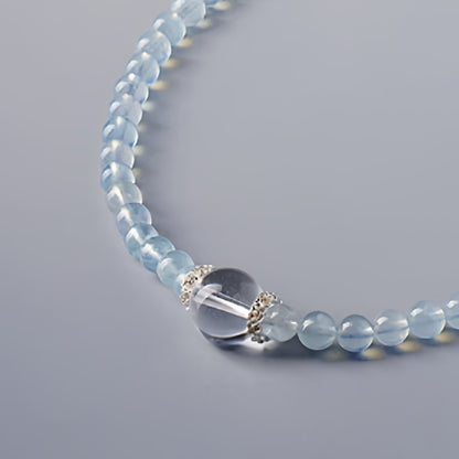 A close-up of aquamarine's clear blue color highlights its effects on communication and emotional balance