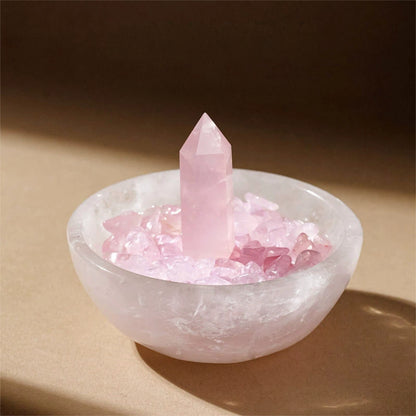 Multiple crystal bracelets and rings nestled on the raw Clear Quartz in the bowl, demonstrating its function as an active defense and charging station for jewelry.