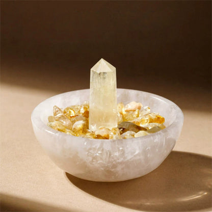 The Selenite energy bowl on a bedside table next to a book and essential oil diffuser, creating a serene and protected atmosphere for sleep.