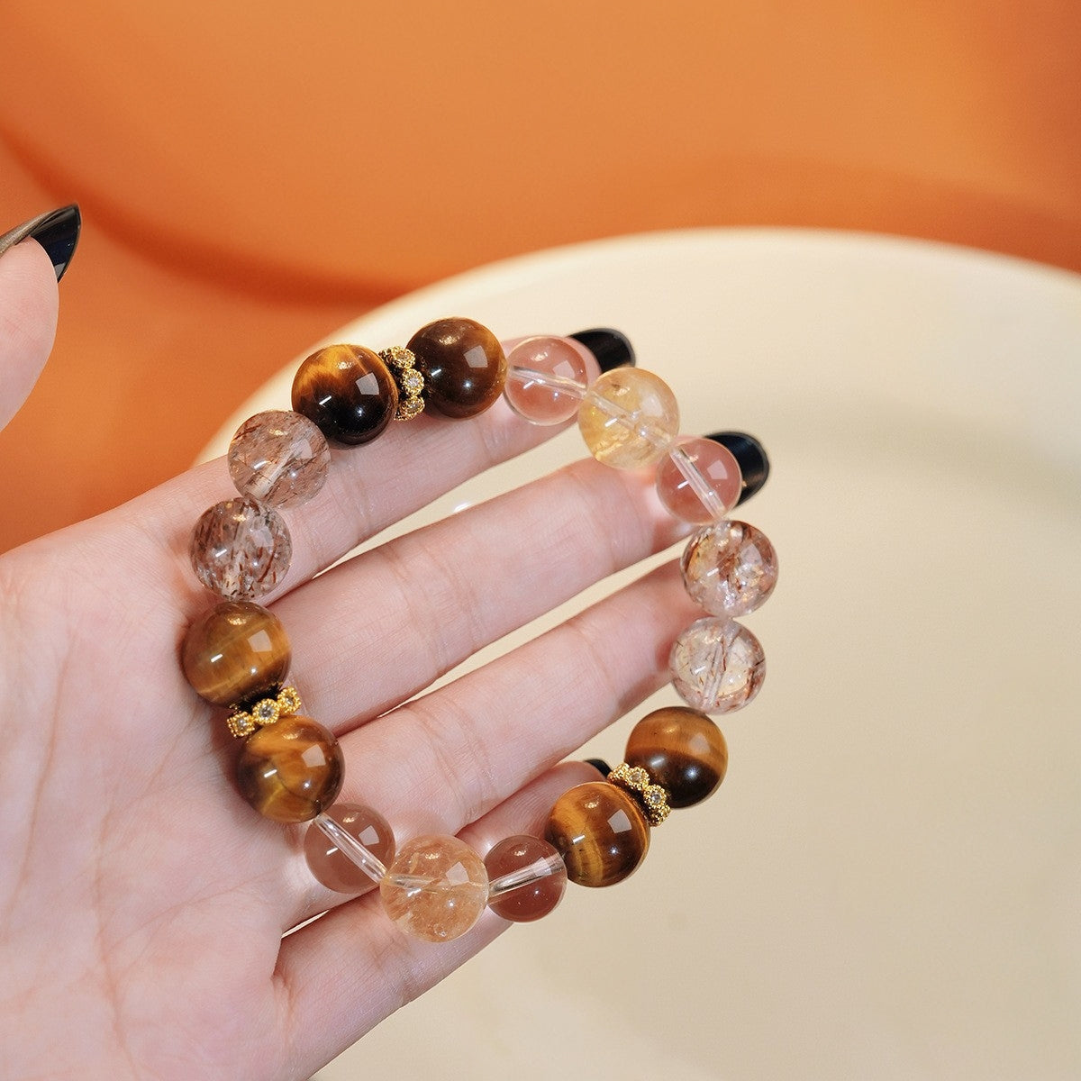 A close-up shot of the Black Gold Super Seven highlights its multi-level mineral structure and powerful energy protection features