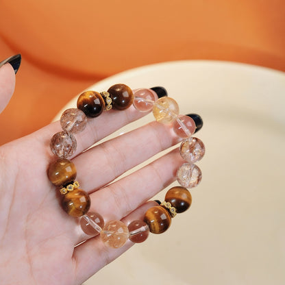 A close-up shot of the Black Gold Super Seven highlights its multi-level mineral structure and powerful energy protection features