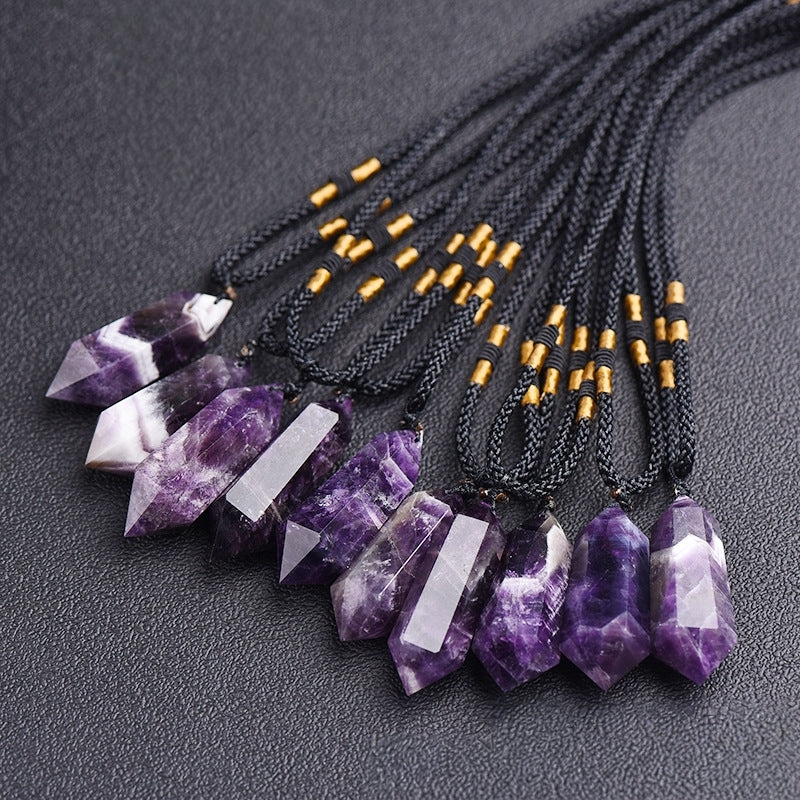 A close-up of the front of the natural amethyst double-pointed hexagonal pendant showcases the perfect cutting craftsmanship