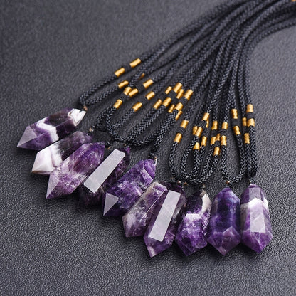 A close-up of the front of the natural amethyst double-pointed hexagonal pendant showcases the perfect cutting craftsmanship