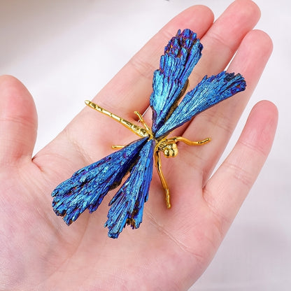 The sculpture serves as the focal point of the creative workbench, surrounded by design sketches and paints scattered around