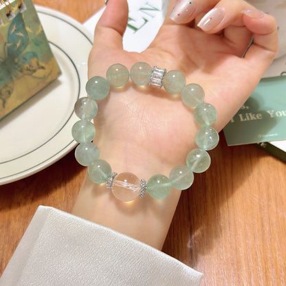 The bracelet is paired with creative tools. Green fluorite inspires creativity and white crystal enhances concentration