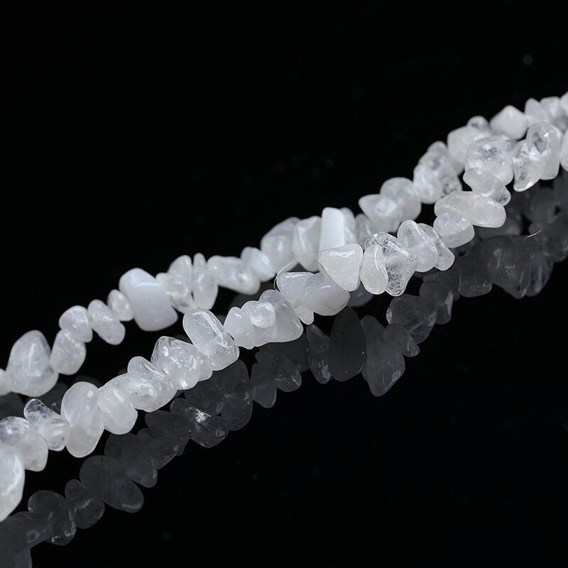 Natural amethyst with porous crushed stones and scattered beads is used for handcrafting spiritual bracelets and necklace accessories.