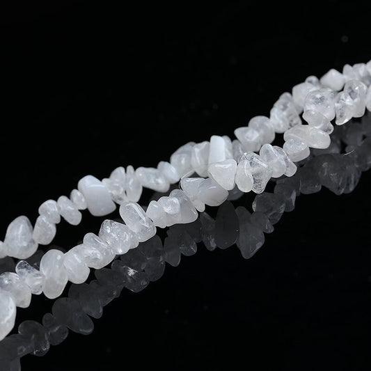 Natural amethyst with porous crushed stones and scattered beads is used for handcrafting spiritual bracelets and necklace accessories.