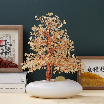 The overall display of the pink, purple and yellow crystal abundant energy tree on the desk serves as a visual tool to enhance concentration and attract career success.