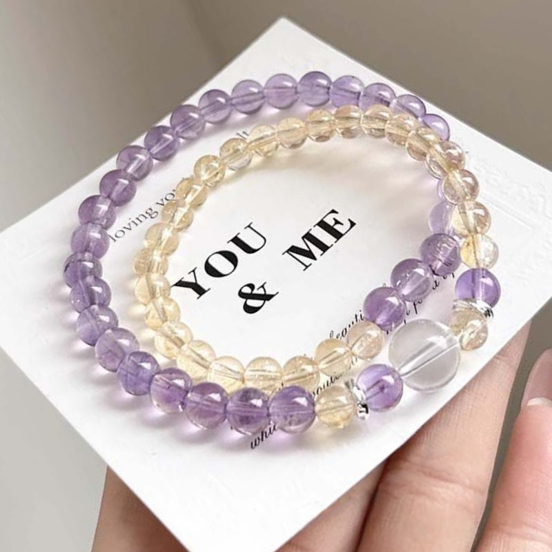 The yellow crystal and amethyst double-ring bracelet paired with koi fish accessories symbolizes both wealth and good luck