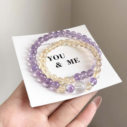 The alternating display of yellow and purple crystals symbolizes energy balance and harmonious integration