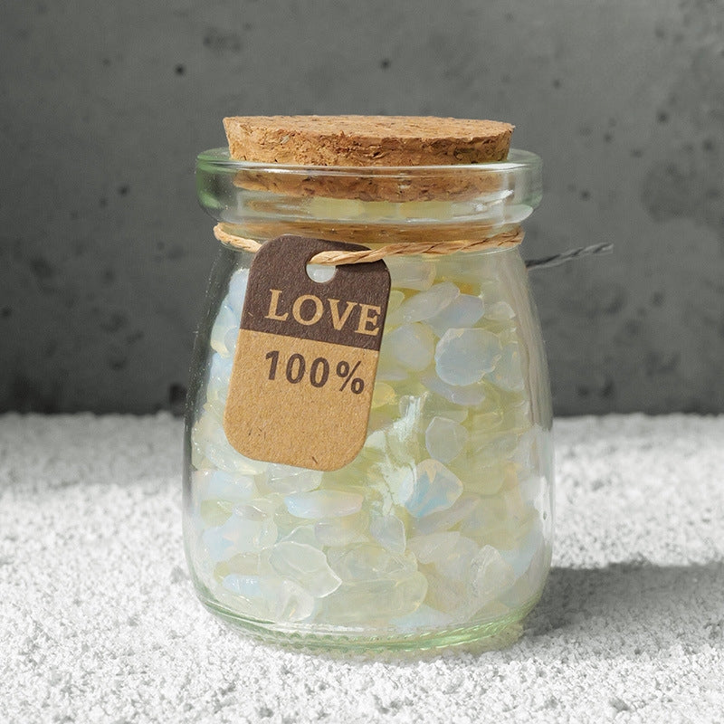 The crystal bottle, along with other large crystal clusters and candles, forms a complete energy corner.