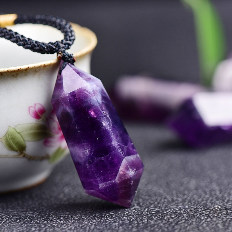Demonstrate the specific methods of using pendants for chakra balancing and energy healing