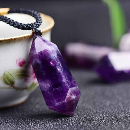 Demonstrate the specific methods of using pendants for chakra balancing and energy healing