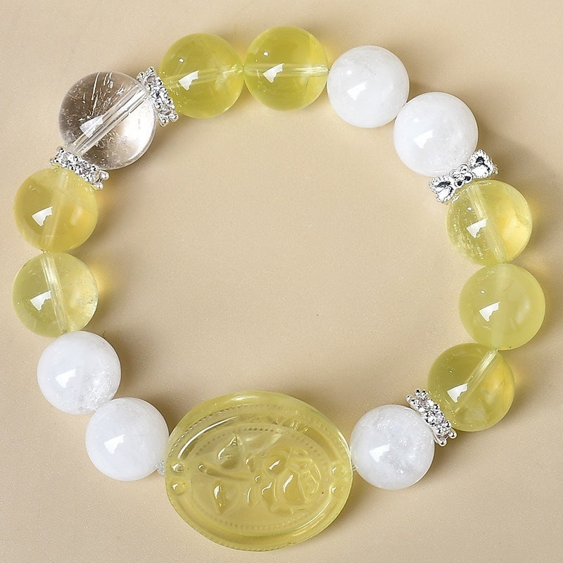 A close-up of citrine paired with a symbol of wealth highlights the auspicious meaning of attracting wealth and treasures