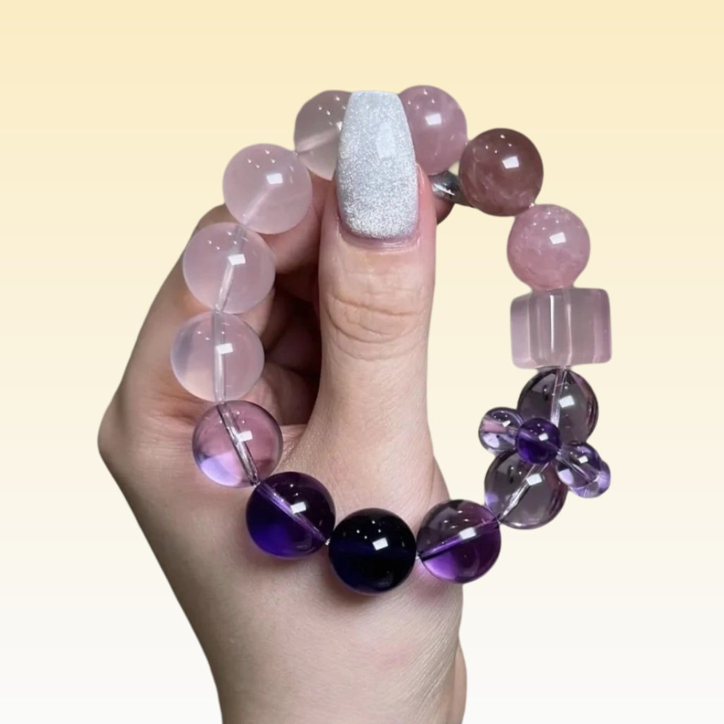 Wearing a bracelet on a woman's wrist and pairing it with gentle clothing showcases her graceful demeanor and energy protection