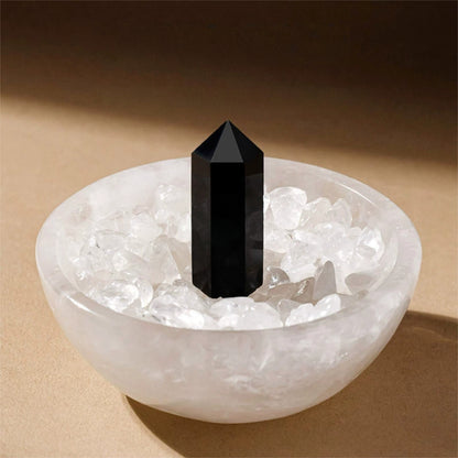 The crystal bowl used as a chic desktop decor next to a laptop and journal for positive energy at work.