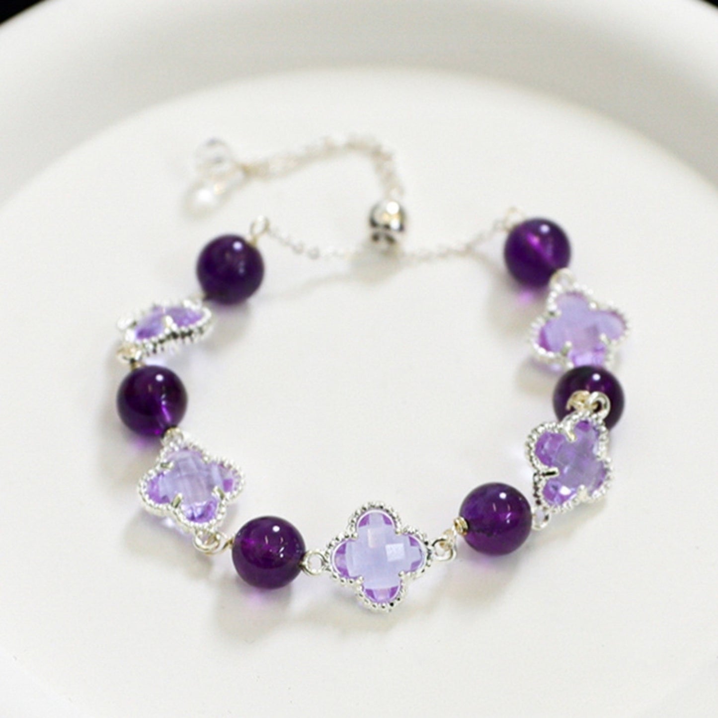 A close-up of the amethyst yellow tower crystal four-leaf clover bracelet, showcasing exquisite design and auspicious meanings