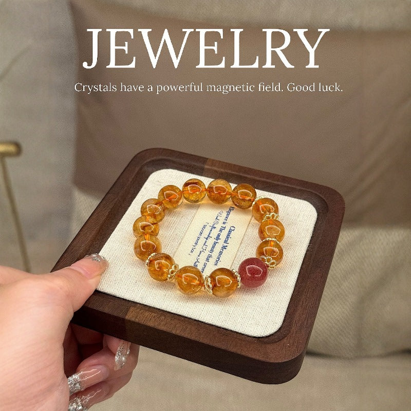 The four-color mixed bracelet of yellow tower crystal, yellow crystal, yellow hair crystal and strawberry crystal showcases all-round fortune and enhances energy