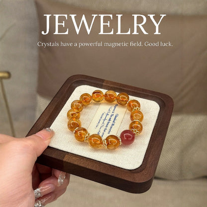 The four-color mixed bracelet of yellow tower crystal, yellow crystal, yellow hair crystal and strawberry crystal showcases all-round fortune and enhances energy