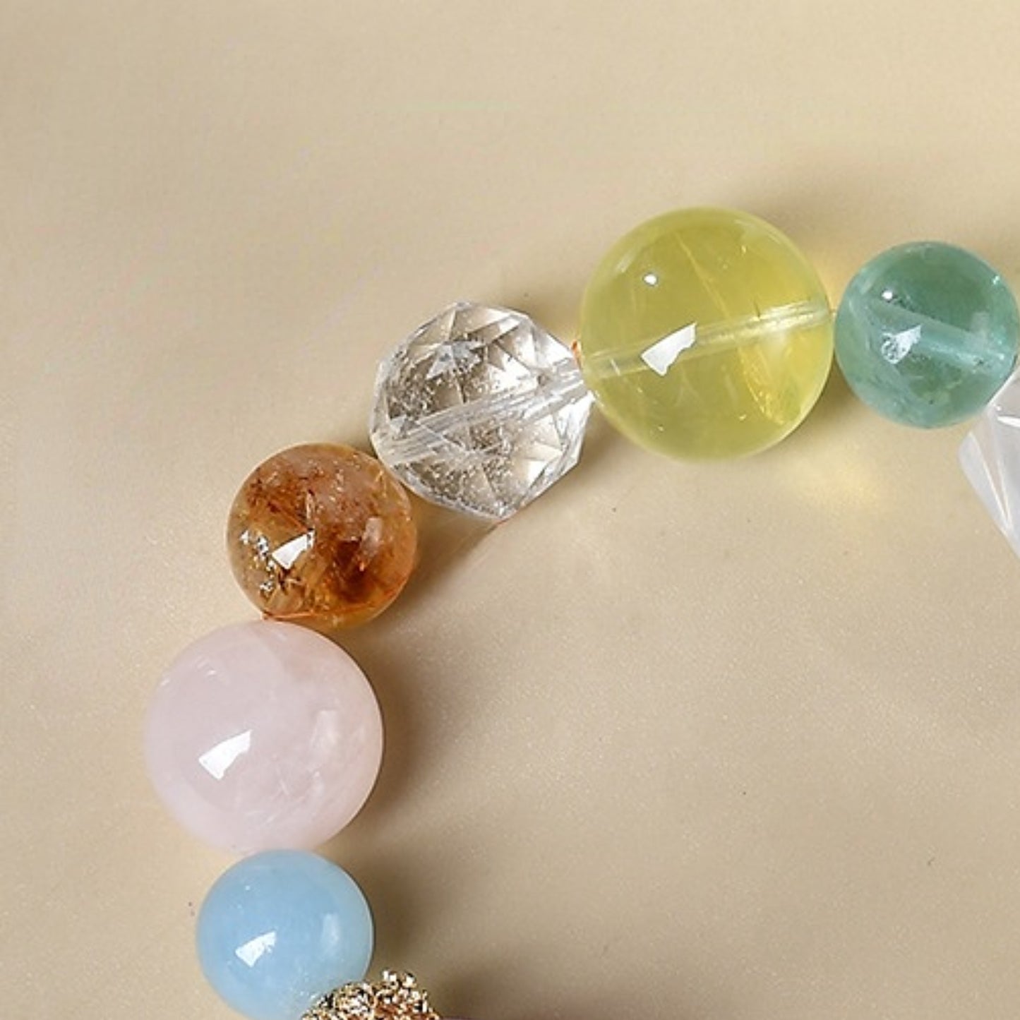 A close-up shot of the golden Asai stone showcases its metallic luster and energy purification properties