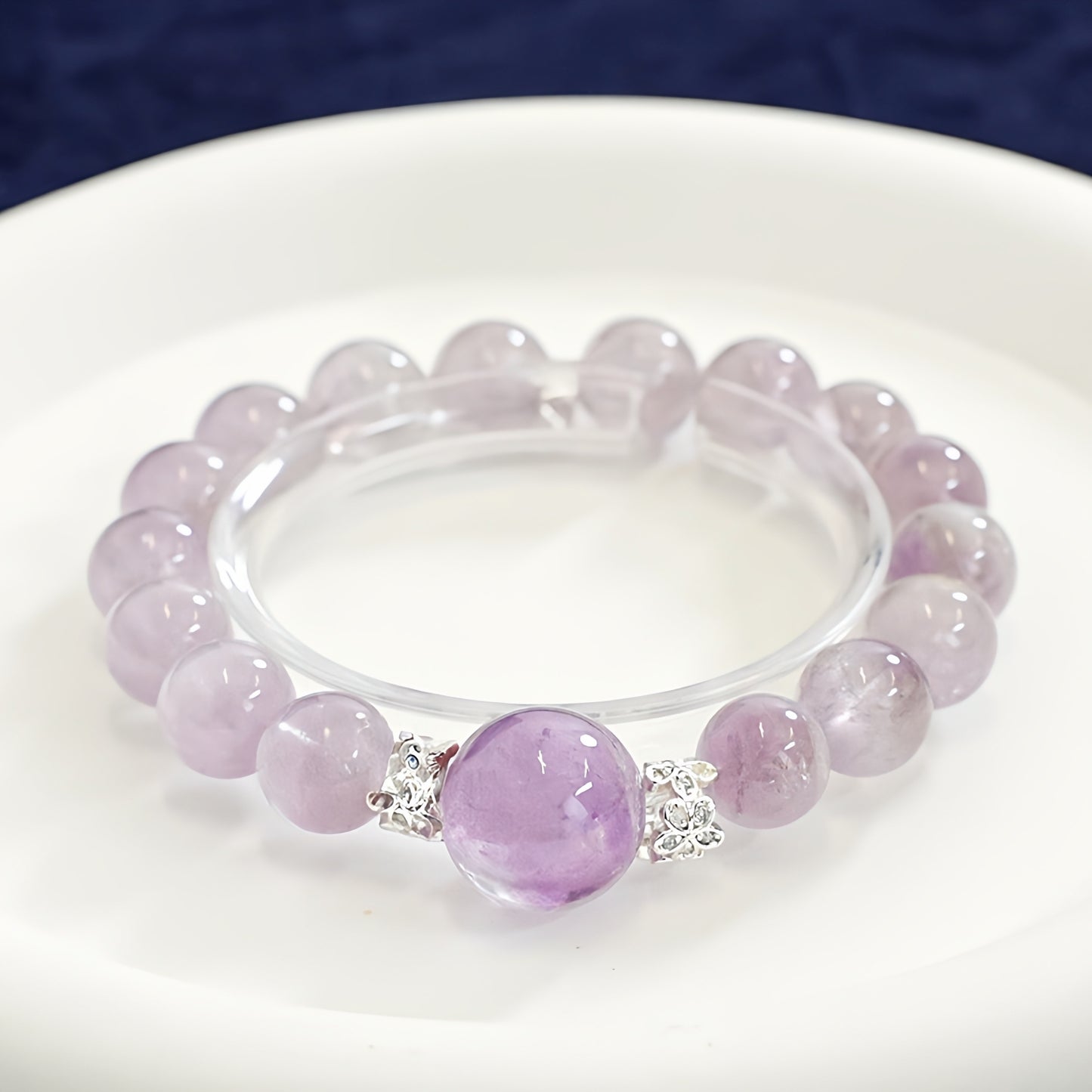 The gift box packaging and bracelet details make it suitable as a commemorative or promotion gift