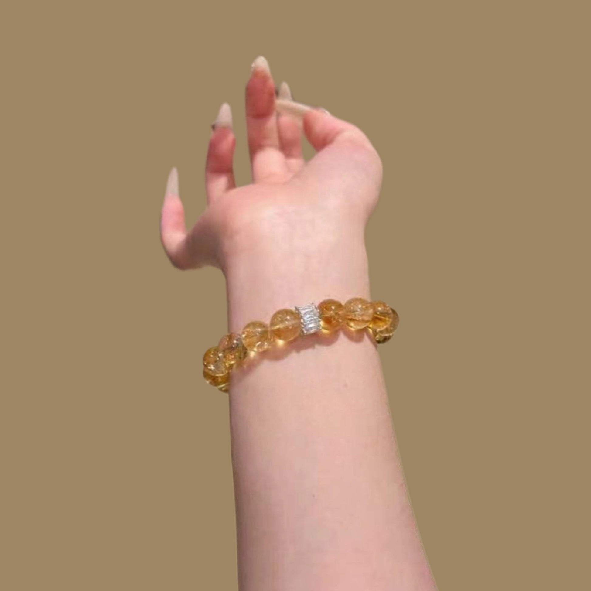 A close-up of the metallic luster of the yellow Asai stone beads, showcasing their energy characteristics of activating personal strength and enhancing confidence