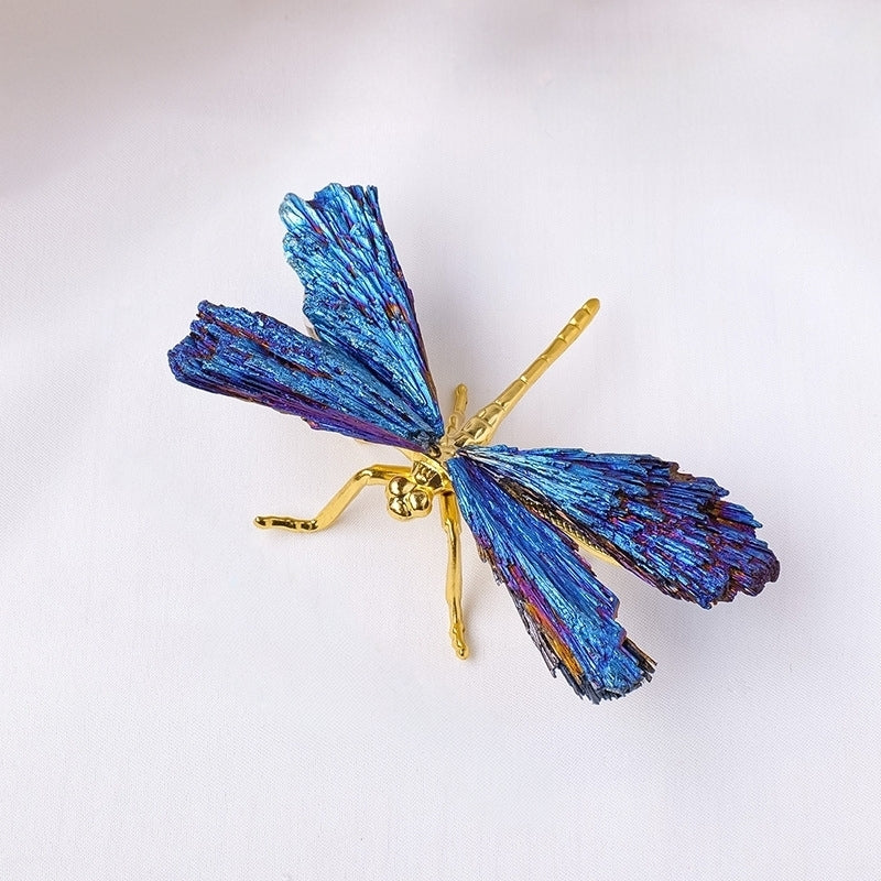 The sculpture is placed on the entrance cabinet, and the morning light filters through the blue feathers, casting dreamy shadows on the wall