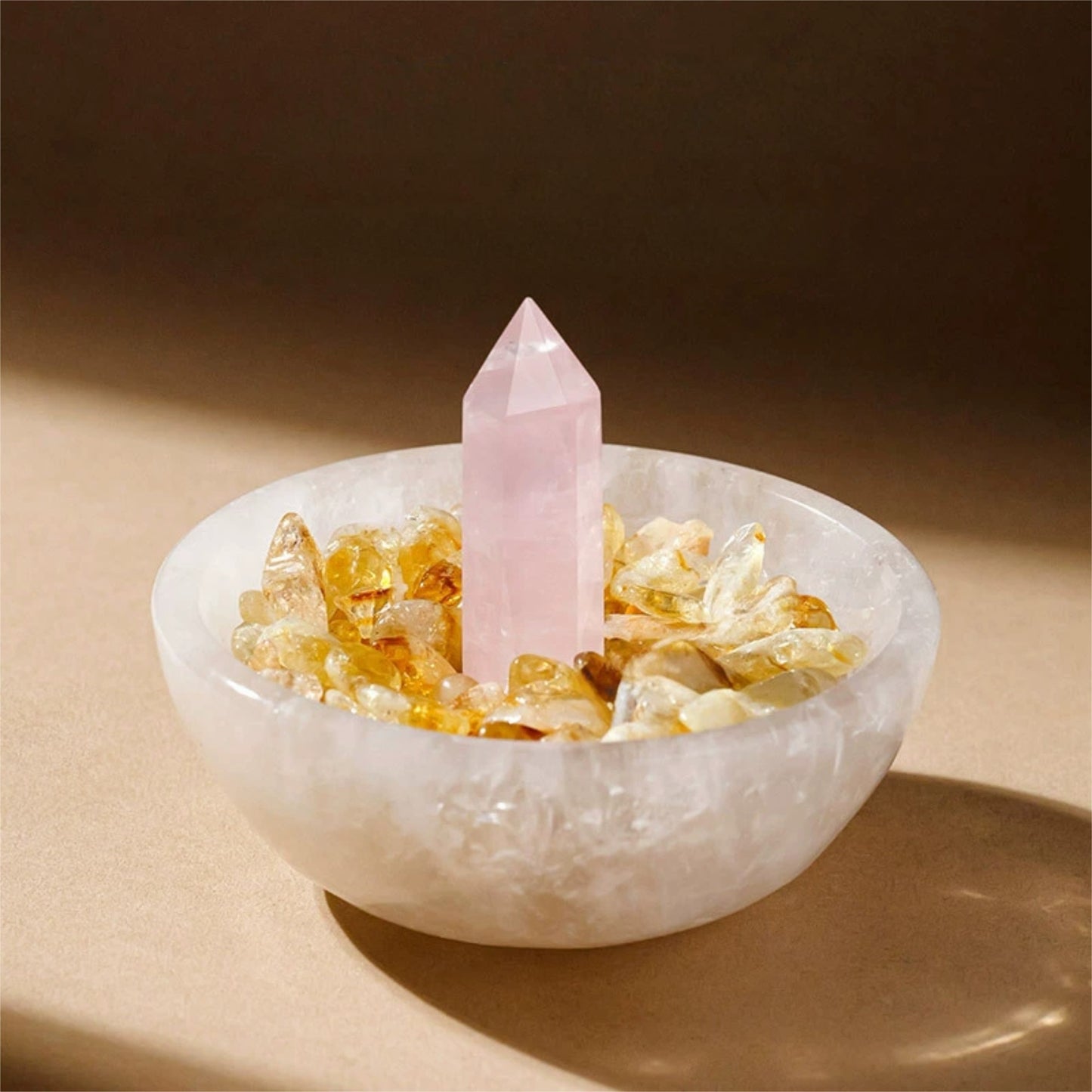 A practitioner meditating on a yoga mat with the Moroccan Selenite charging bowl placed in front, acting as an energy focal point and charging base.