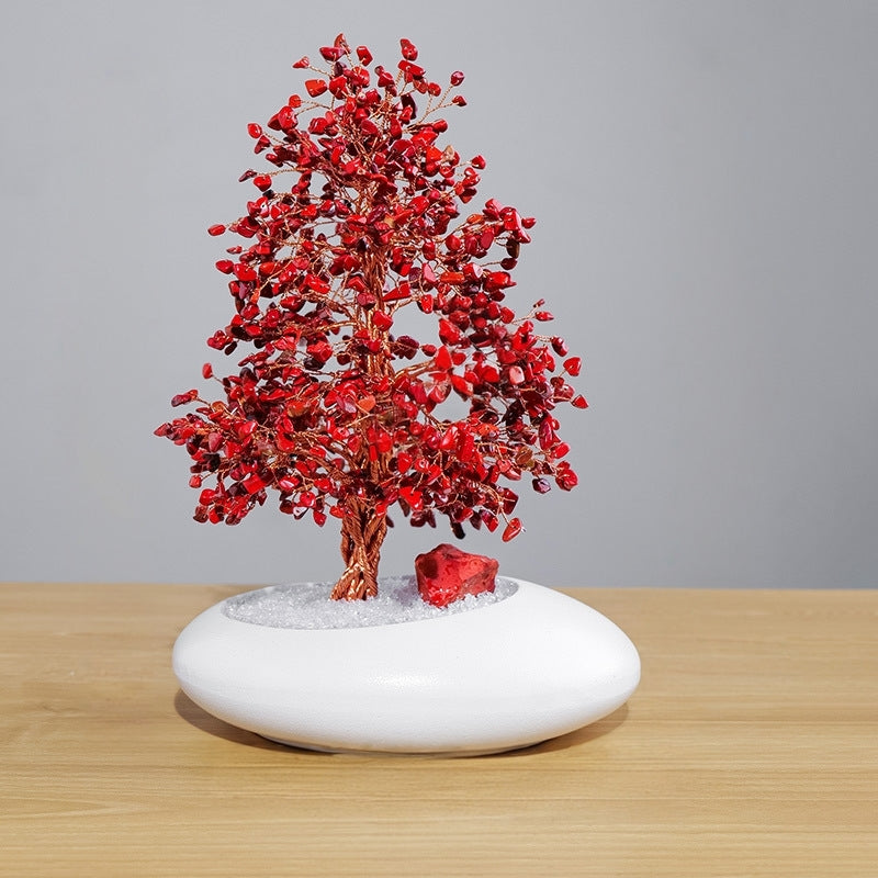 The crystal tree is placed in the meditation corner, alongside candles and crystal arrays, serving as an energy anchor point for deepening meditation practice.