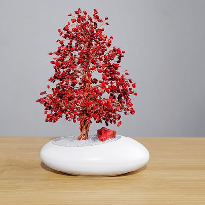 The crystal tree is placed in the meditation corner, alongside candles and crystal arrays, serving as an energy anchor point for deepening meditation practice.