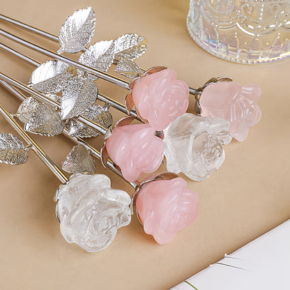 The crystal rose serves as the core of the meditation space, with a candle lit in front of it, creating a serene and sacred atmosphere.