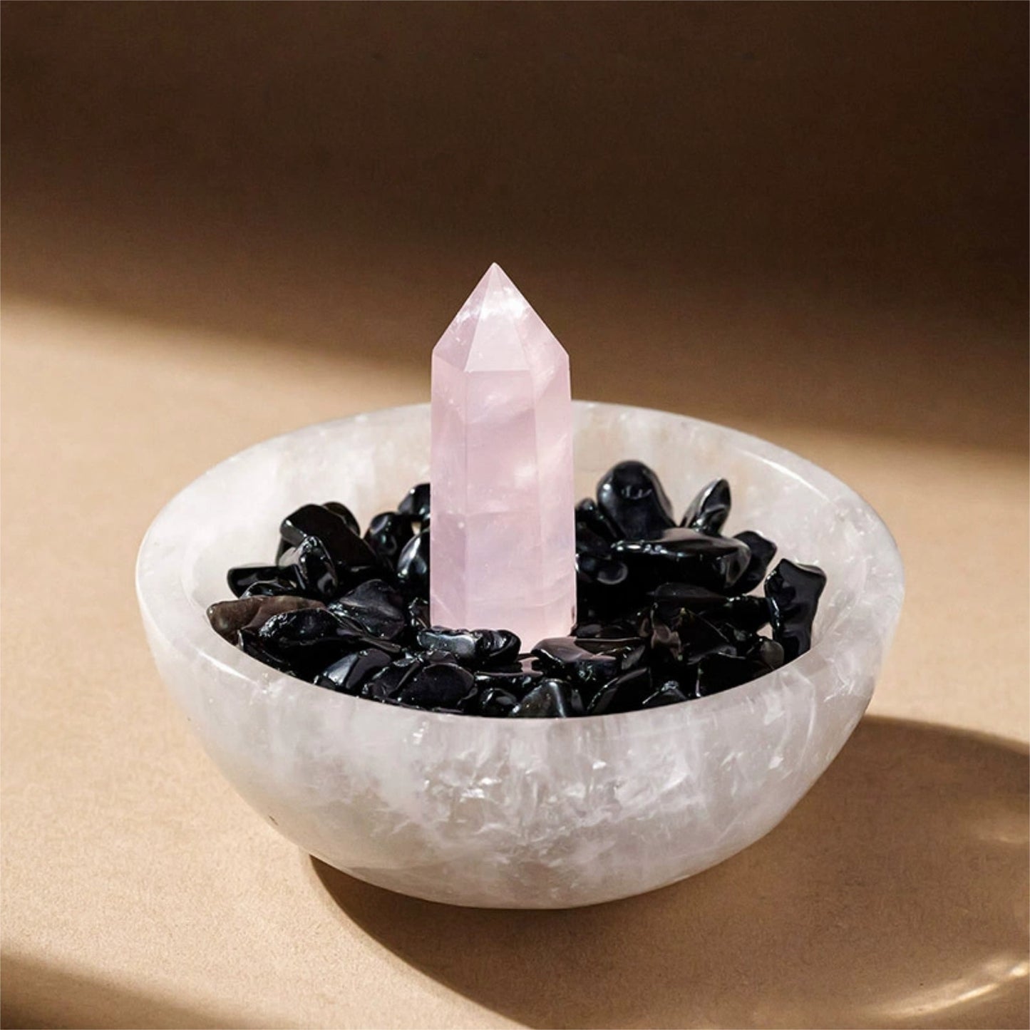 The Selenite energy bowl sits among a laptop and stationery, bringing tranquil and clear energy to a home office space to spark creativity.