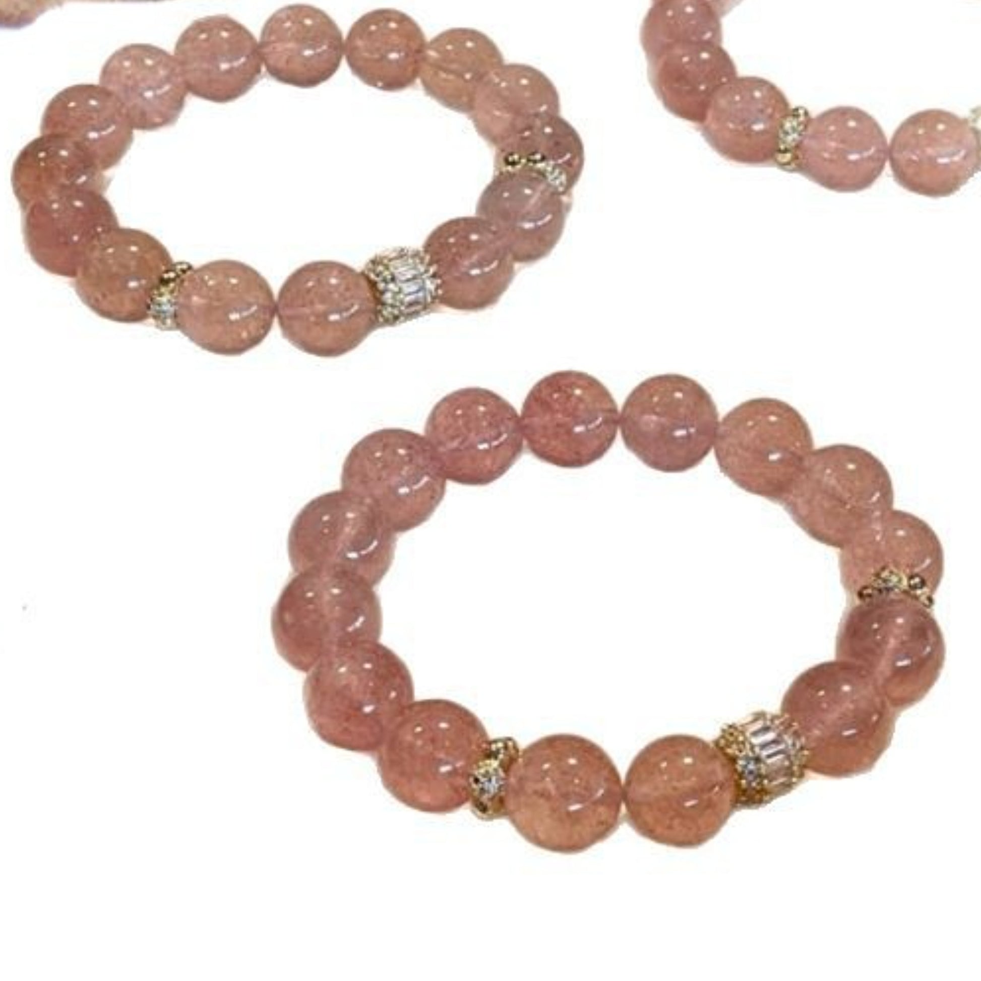 Close-up of the natural strawberry crystal bracelet, clearly showing the internal red inclusions and the soft pink color. 
