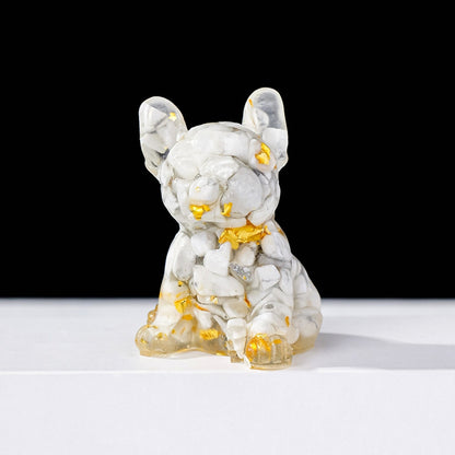 The warm glow of the crystal puppy under the desk lamp at night