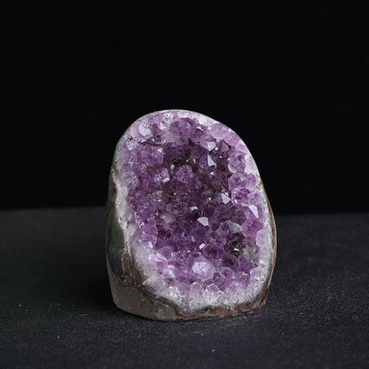 Amethyst clusters are placed beside office computers, serving as energy guardians to neutralize electronic smog while enhancing concentration and decision-making wisdom.