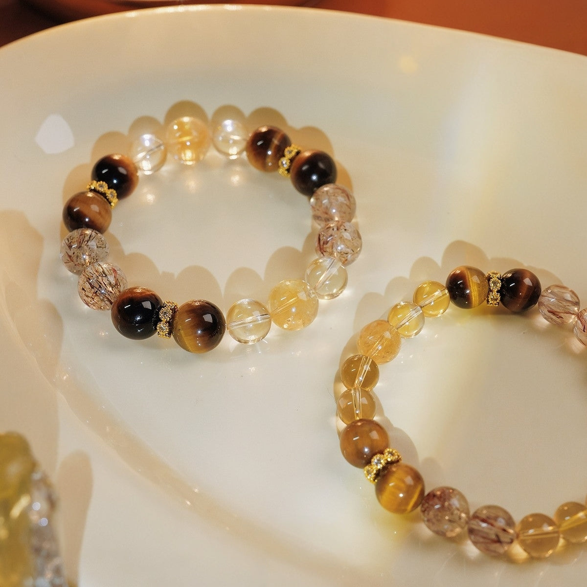 The bracelet is carefully placed on the desk, forming a feng shui layout that attracts wealth and guards against villains