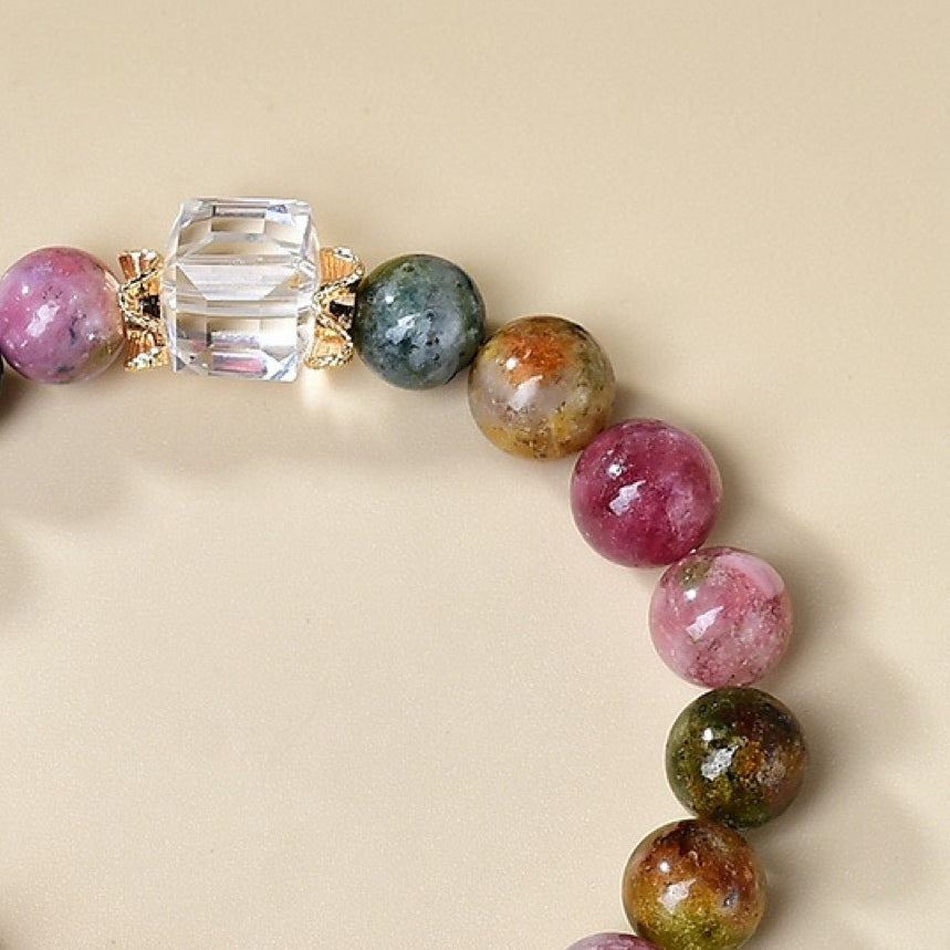 A close-up of the cherry blossom accessories showcases the three-dimensional carving craftsmanship and the details of the petals