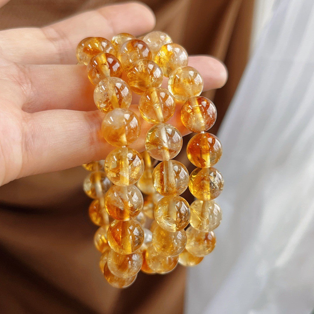 A close-up of wearing a bracelet symbolizes awakening inner strength, enhancing decisiveness and a sense of self-worth