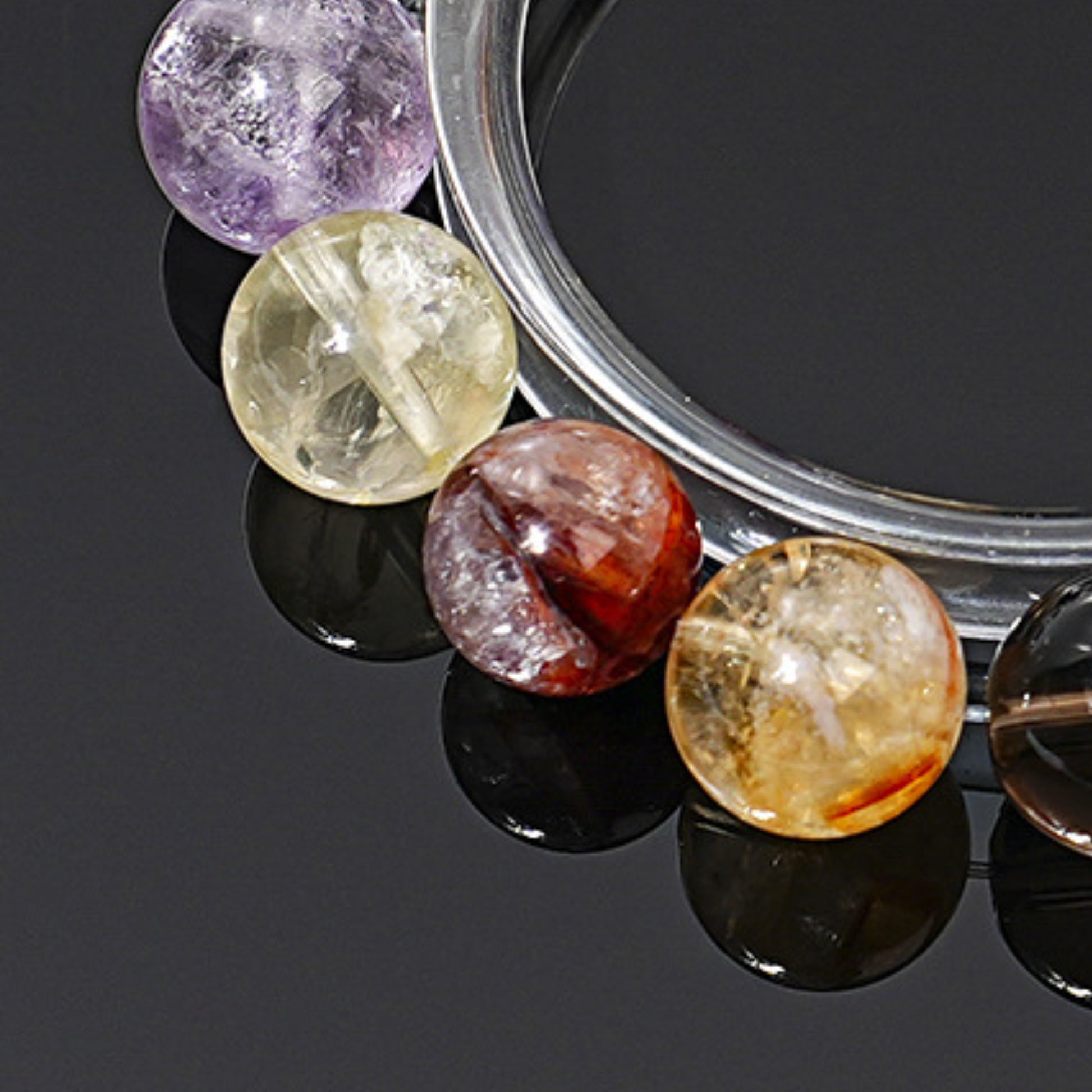 A close-up of the red inclusions inside the red gum flower crystal, showcasing its powerful energy for attracting wealth and good fortune