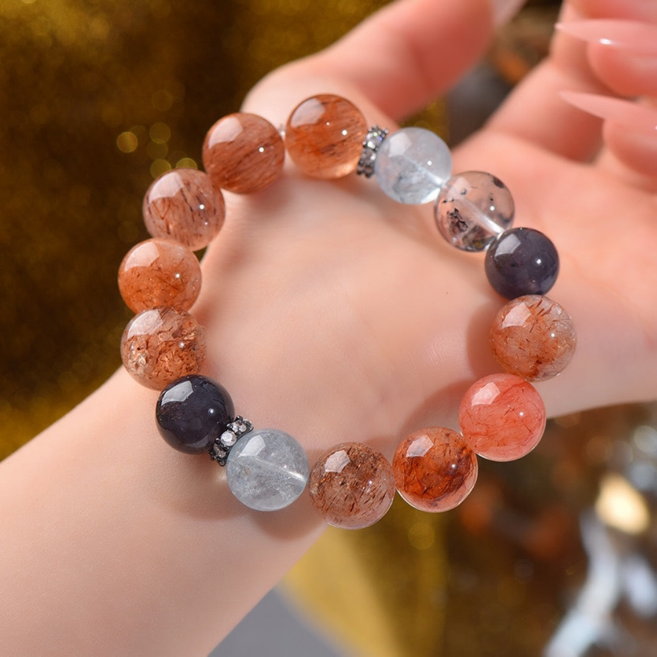 The black and gold Super Seven bracelet designed for Scorpios enhances their insight and magnetic field protection, making it suitable for deep emotional healing.